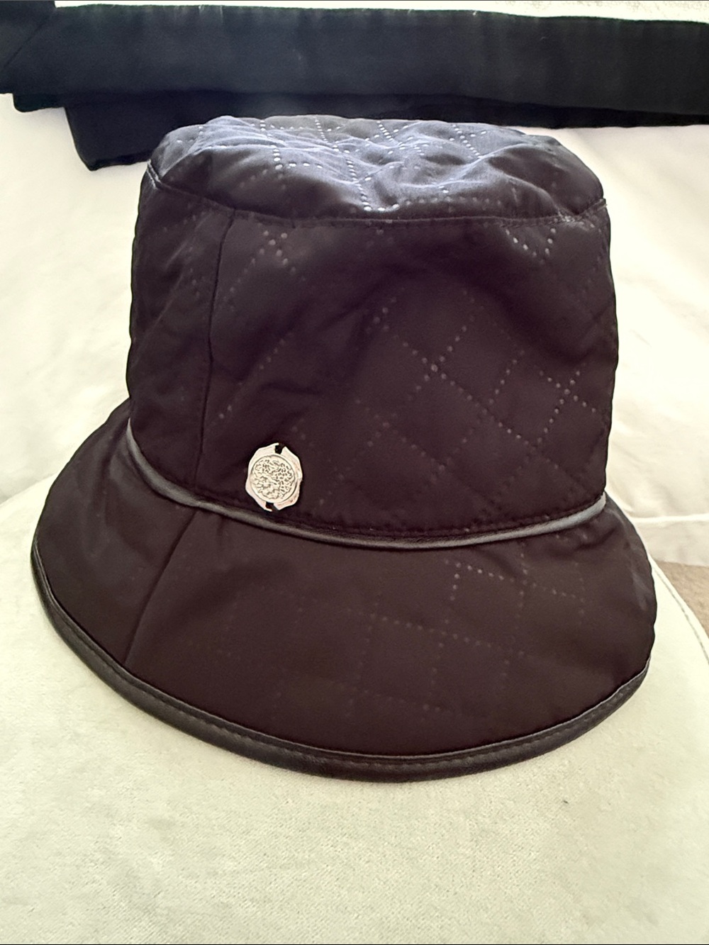 Vince Camuto Quilted Black Bucket Hat with Silver Medallion - Picture 4 of 4